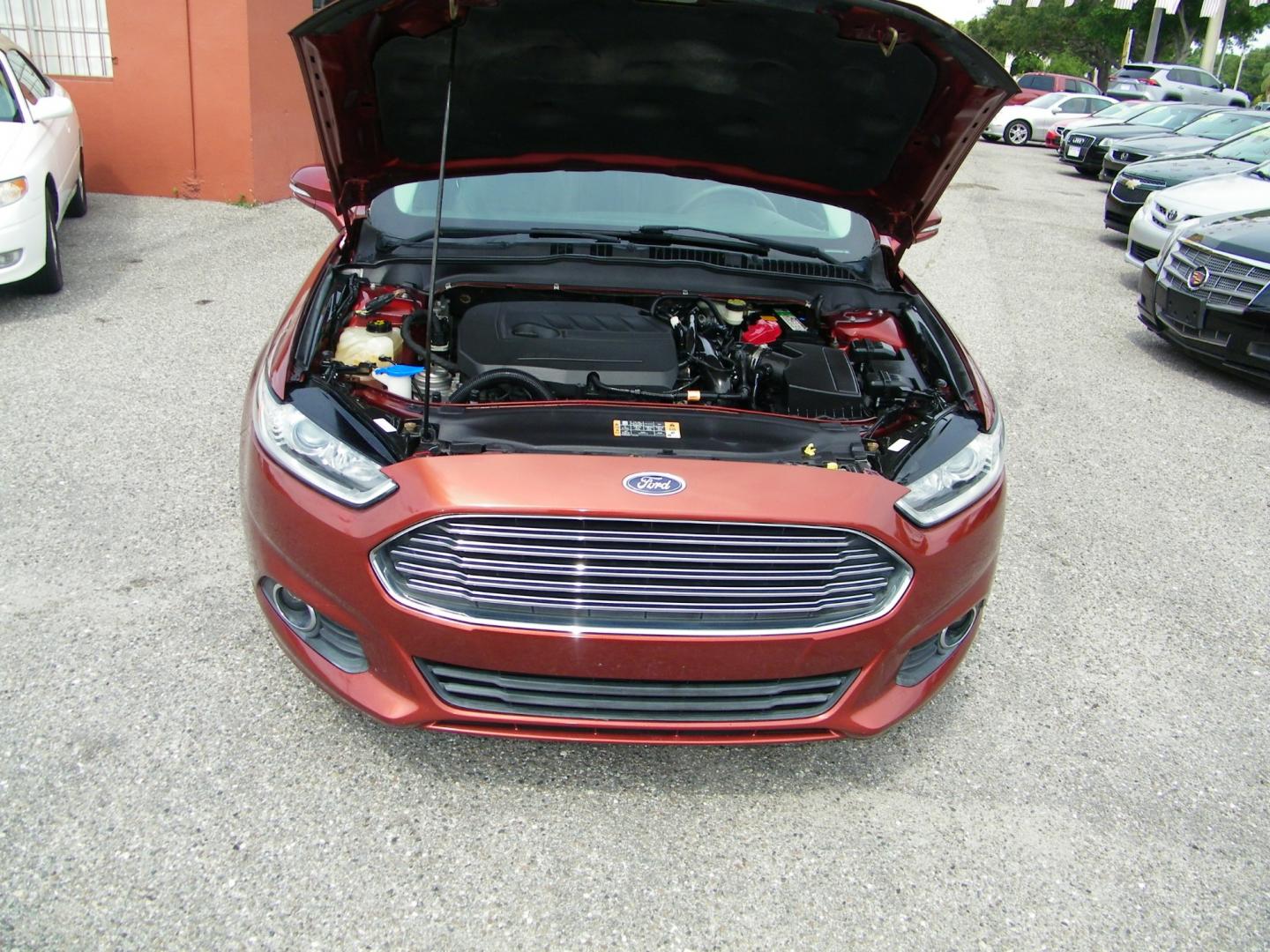 2014 Orange /Black Ford Fusion SE (3FA6P0HD7ER) with an 1.5L L4 DOHC 16V engine, Automatic transmission, located at 4000 Bee Ridge Road, Sarasota, FL, 34233, (941) 926-0300, 27.298664, -82.489151 - Photo#8